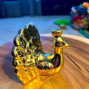 Gold ceramic peacock